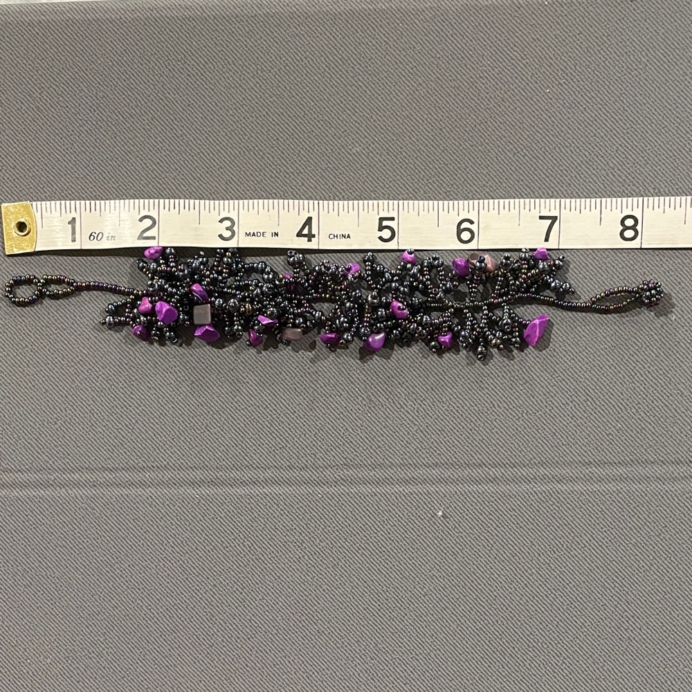 Elegant Handcrafted Black and Purple Beaded Bracelet